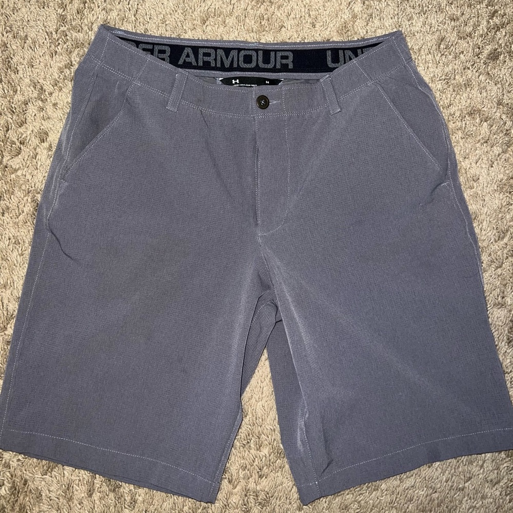 Under Armour heat gear mens button fly shorts 
Size 34